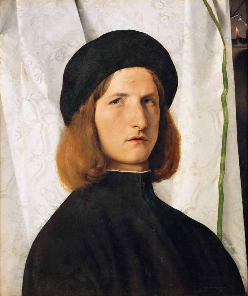 Portrait of a young man in front of a white curtain. Lorenzo Lotto