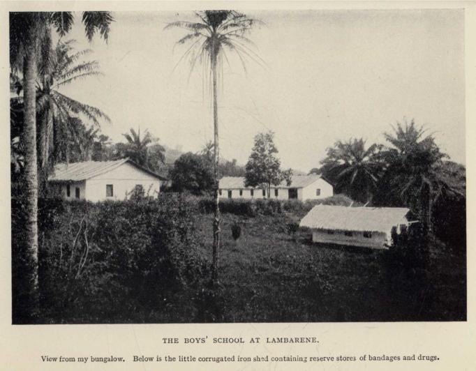 THE BOYS' SCHOOL AT LAMBARENE. View from my bungalow. Below is the little corrugated iron shed containing reserve stores of bandages and drugs.