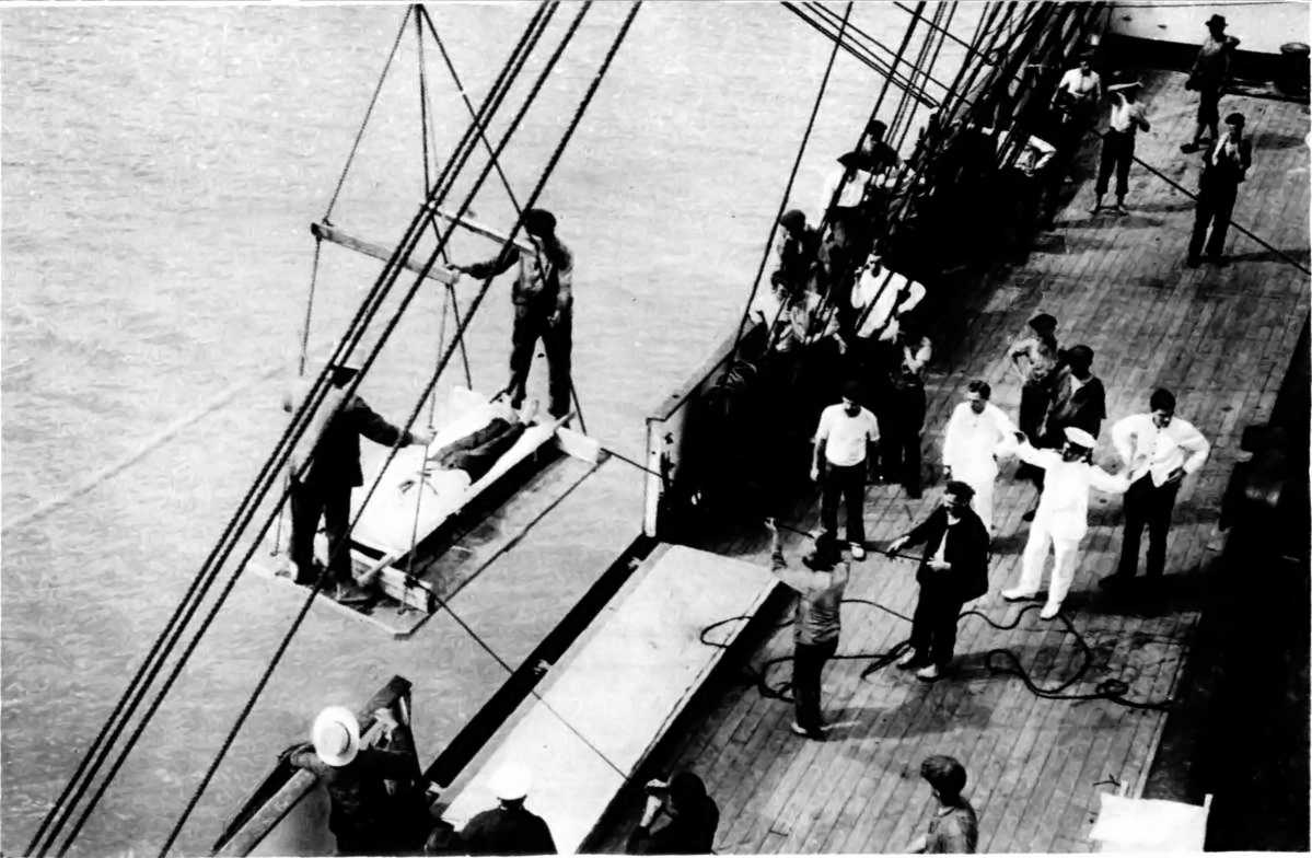 THE ATTACK ON THE "PEGASUS" BY THE "KÖNIGSBERG" (NOW "IMPRISONED"): TRANSHIPPING WOUNDED TO THE HOSPITAL-SHIP "GASCON."