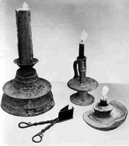 [Illustration: Both brass and pottery candlesticks have been found. The candle was the standard lighting device during the 17th century.]