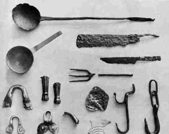 [Illustration: A few kitchen utensils and accessories excavated at Jamestown: a ladle, brass pan, knife blades, fork, kettle fragments, spout, colander fragments, and pot hooks.]