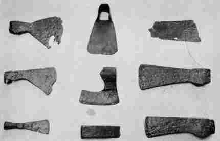 [Illustration: A few of many tools unearthed at Jamestown which were used for timbering: felling axes, a hewing axe, adze, hatchet, wedge, and saw fragment.]