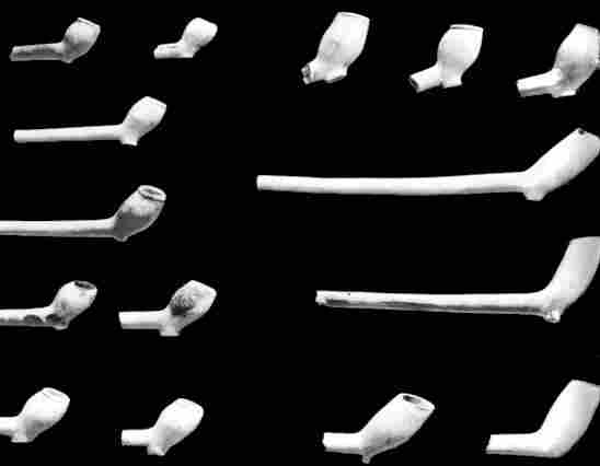 [Illustration: A few of thousands of clay pipe fragments unearthed at Jamestown. The ones shown range in date from 1600 to 1700. During this 100-year period, pipes developed from small bowls to fairly large ones.]