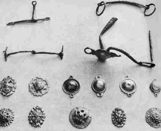 [Illustration: Some bits and bridle ornaments in the Jamestown collection. The artistic designs on many bridle bosses are symbolic of beautiful handiwork performed by craftsmen of a bygone day.]