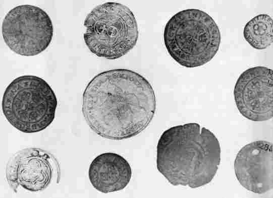 [Illustration: Brass casting counters excavated on Jamestown Island. Many were made in Germany before 1575 for use by merchants on counting boards. In the New World they were used for the Indian trade.]