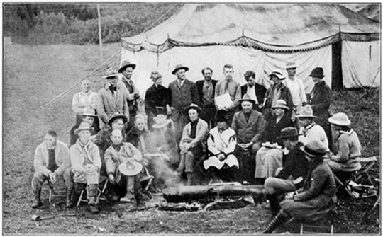 A RAINY DAY IN CAMP (Howard Eaton is fifth from left of those standing)