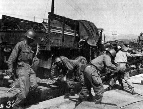 25th Division Troops Unload Trucks and Equipment
