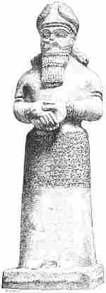 Fig. 15.—Statue of Nebo; from Nimroud. British Museum. Calcareous stone. Height 6 feet 5 inches.