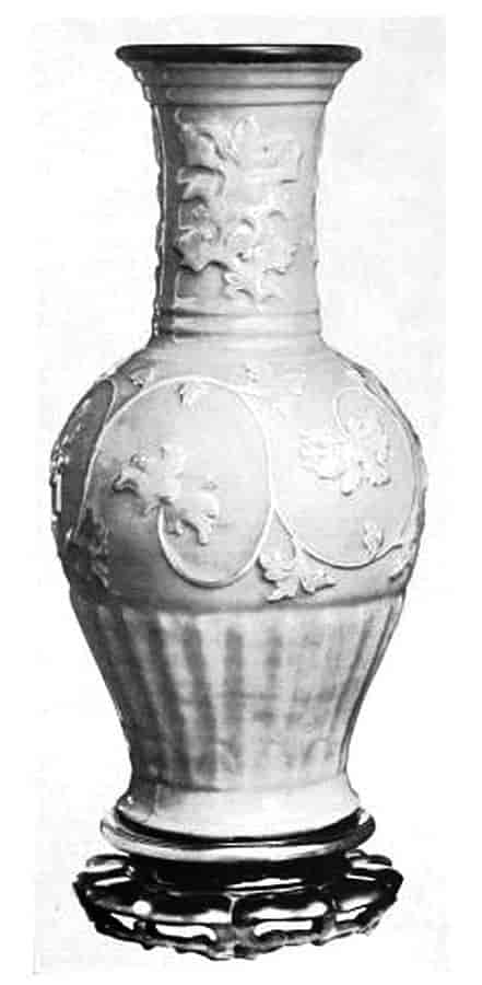 Vase sitting on low stand