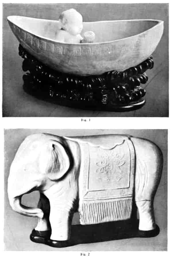 Elephant is decorated with fringed drape and flat saddle