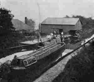 WHARF AT FACTORY AT KNIGHTON, AT WHICH MILK IS EVAPORATED FOR MILK CHOCOLATE MANUFACTURE. (Messrs. Cadbury Bros., Ltd.)