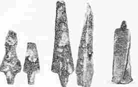 No. 252. No. 253. No. 254. No. 255. No. 256. Trojan Lance-Heads of Copper.—TR. No. 256. Copper Lance and Battle-Axe welded together by the Conflagration. The Pin-hole of the Lance is visible.—TR.
