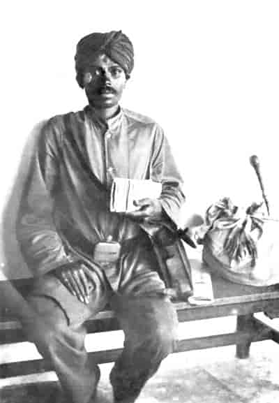 The Indian Village Postman. (The white paint-marks on his forehead and cheeks indicate that Vishnu is his special god.)