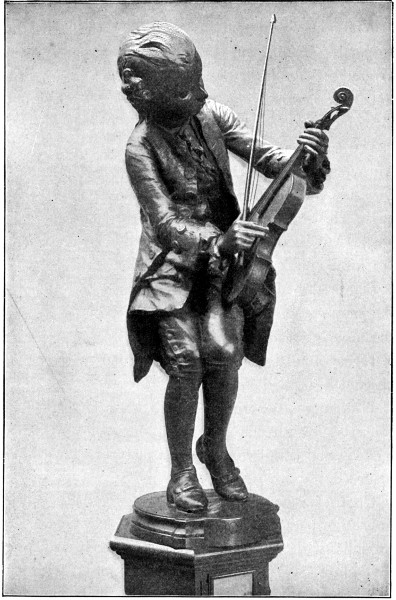 Sculpture of child Mozart playing the violin.