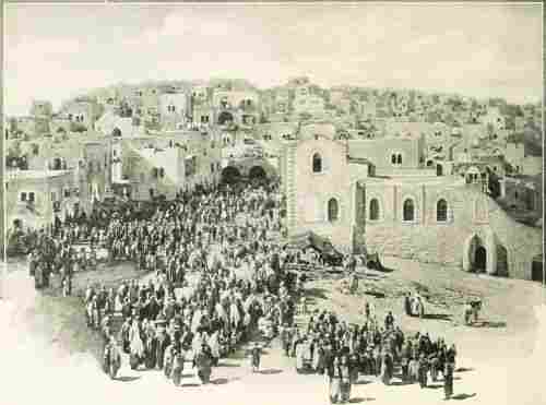 Crowd of people entering Bethlehem