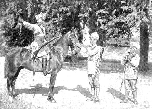 A Scout of the Guides' Cavalry warning his Infantry Comrades. The small man on the right is a Gurkha