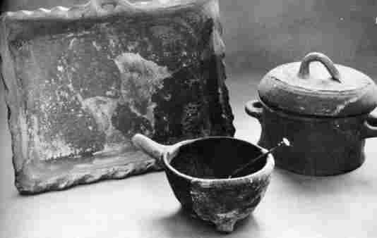 [Illustration: Many earthenware vessels found were used for cooking purposes, including baking dishes, three-legged pots, and covered pots.]