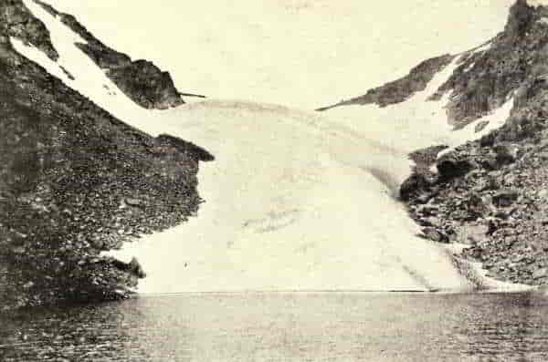 THE ANDREWS GLACIER HANGS FROM THE CONTINENTAL DIVIDE